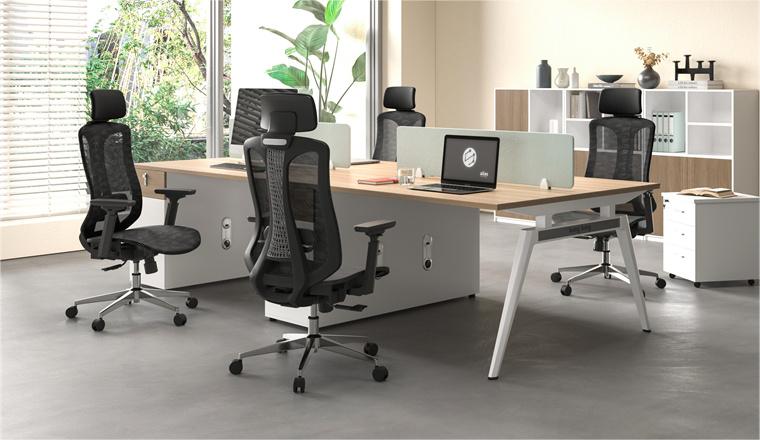 An office scene with 4 office chairs, 2 office desks and cubicle