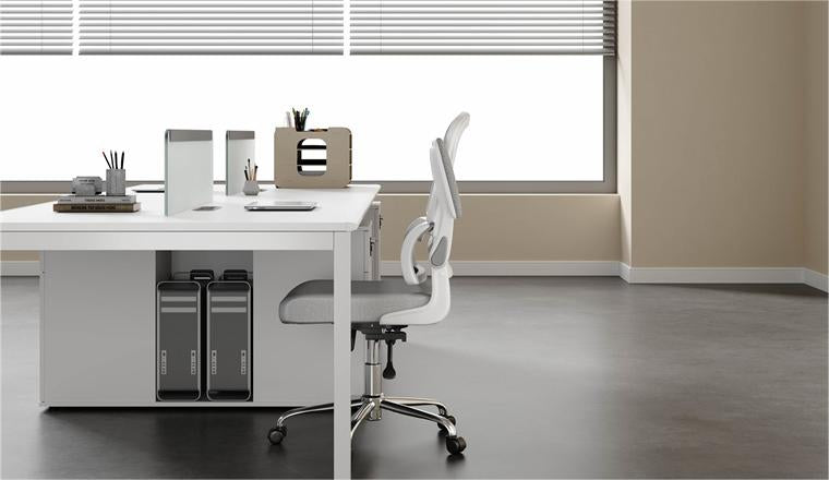 An worplace scenery with a white back and grey mesh ergonomic office chairs