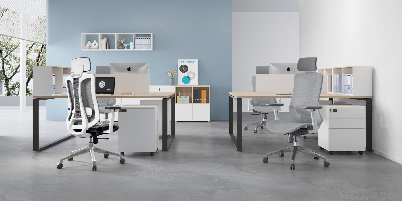 An office scene with 4 office chairs, 2 office desks and cubicle, with storage cabinets under each desk